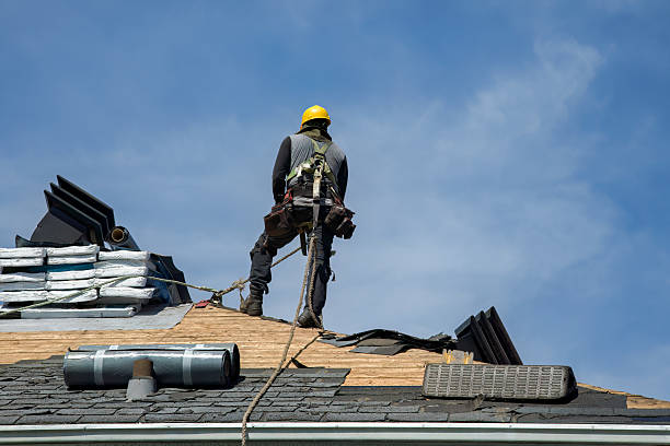 Professional Roofing technician working in Bell, CA